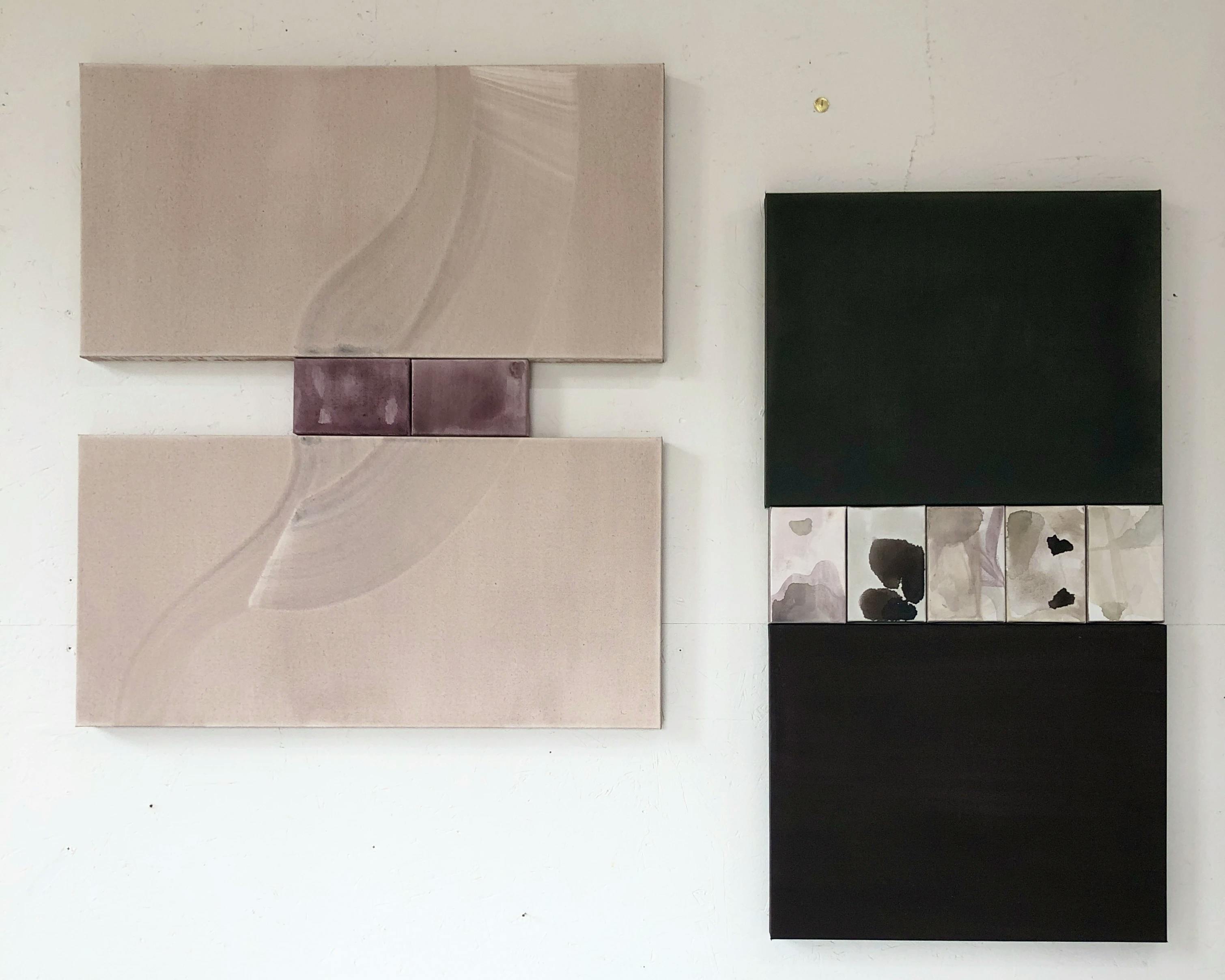Diptychs with inlaid canvas blocks installed on a white wall in artist Laura Naples' studio.
